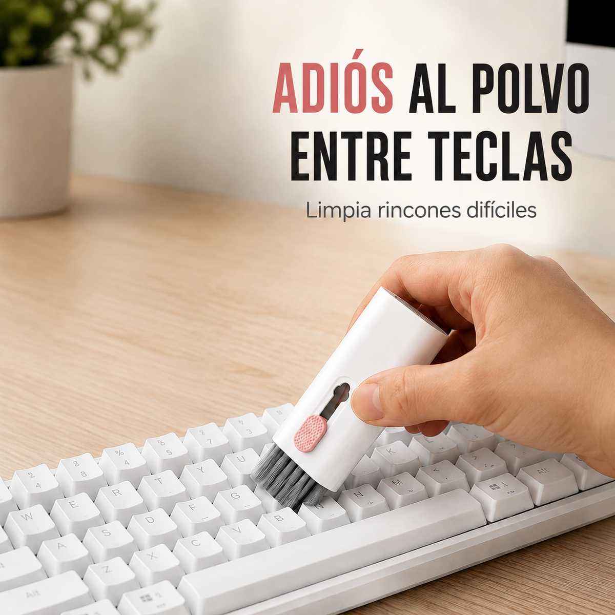 Kit de limpieza 7 en 1 rosado eliminando polvo entre las teclas