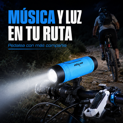 Parlante Zealot S1 con linterna iluminando una ruta nocturna en bicicleta